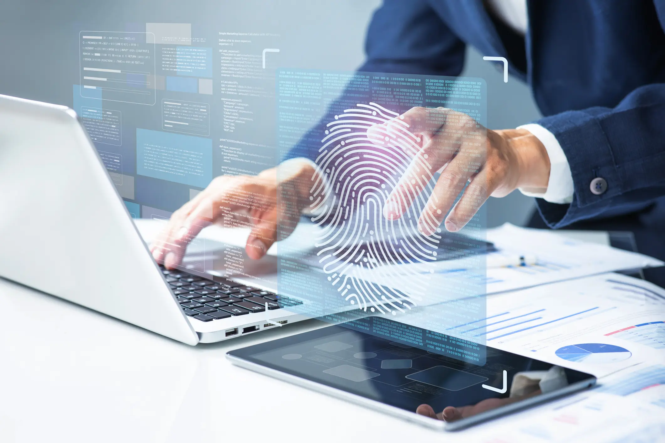 Person using laptop with biometric fingerprint overlay